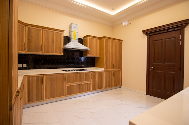 Wooden Cabinetry With Benchtops and Splashbacks
